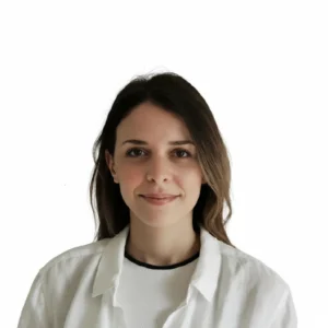 Smiling French tutor in Hong Kong teaching students in a classroom