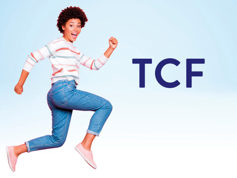 TCF French exam joyful woman jumping