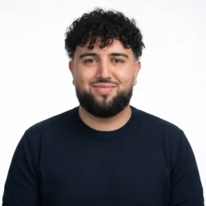 French tutor Sofiane smiling during a language lesson in Hong Kong